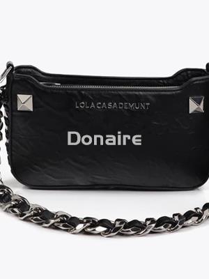 Bolsito efecto piel arrugada y tachas metálicas - Imagen 1